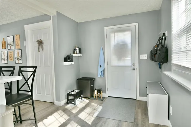 a view of a livingroom with furniture and a window