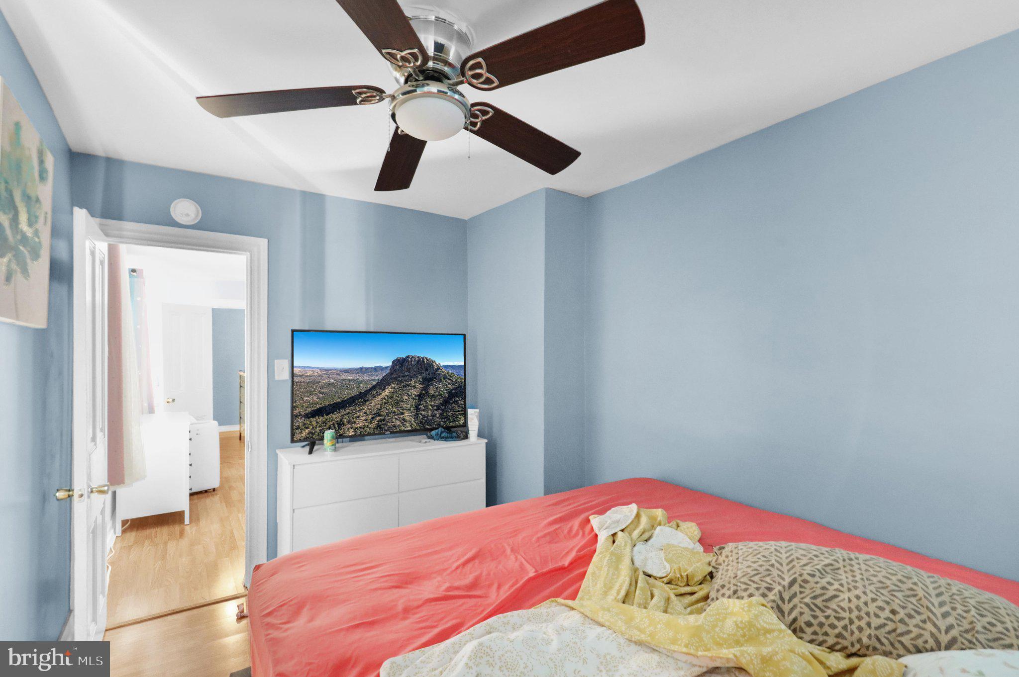 1122 Buttonwood Street Reading, PA 19604 - Photo 16 of 18 a bedroom with a bed and a wall painting