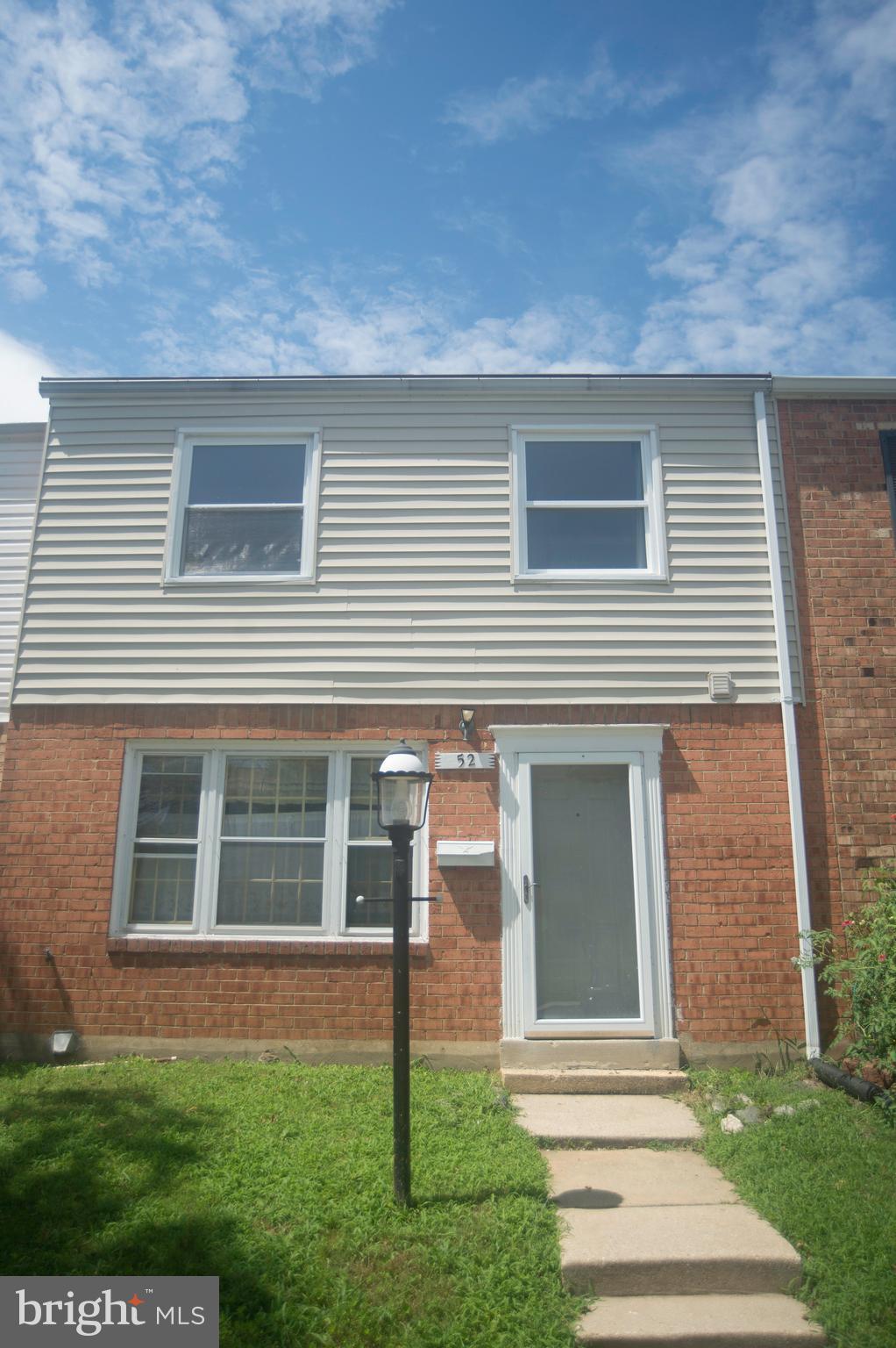 52 Timber Rock Road Gaithersburg, MD 20878 - Photo 2 of 30 front view of a house with a yard