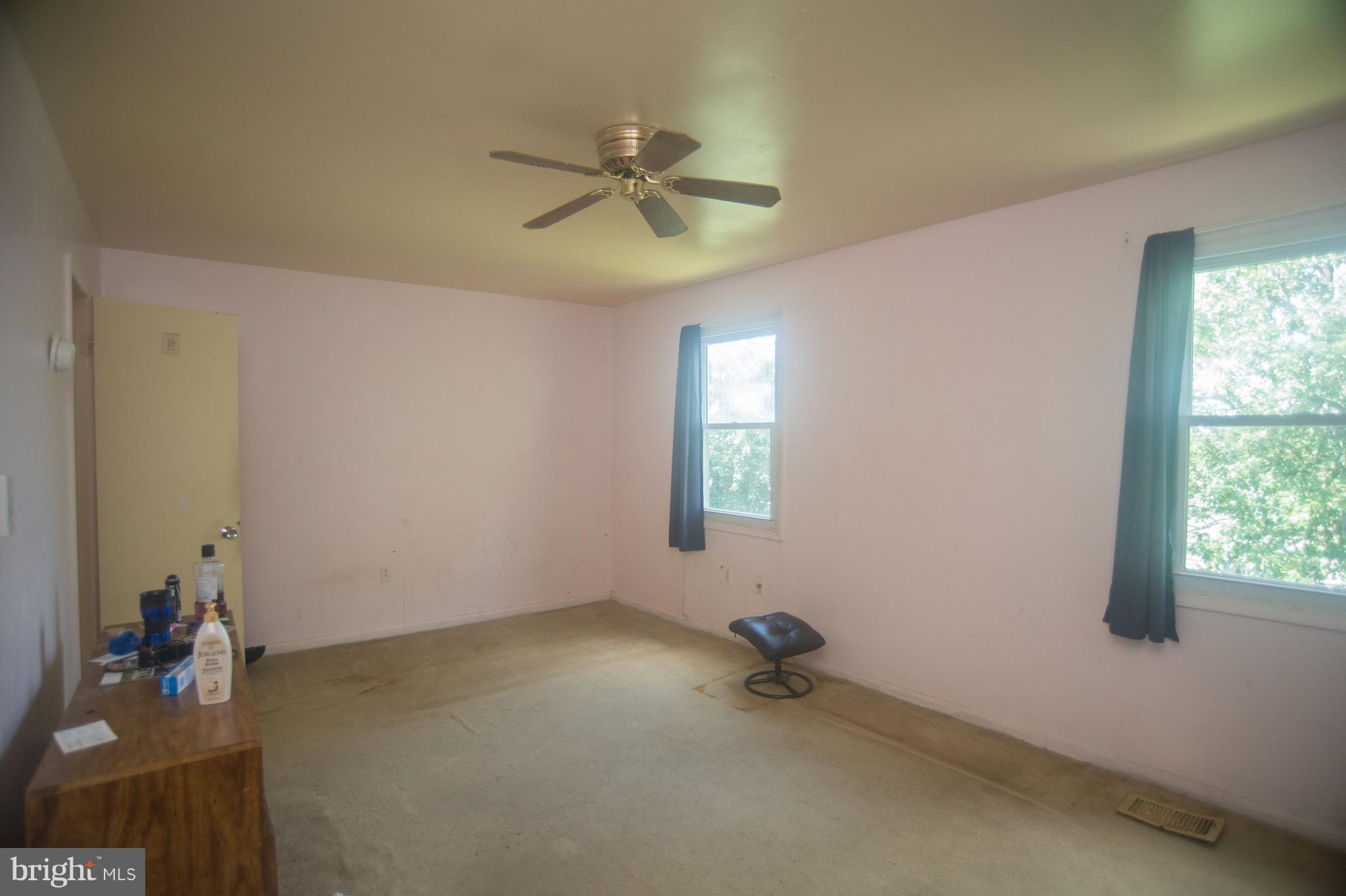 52 Timber Rock Road Gaithersburg, MD 20878 - Photo 12 of 30 a view of a room with a ceiling fan and a window
