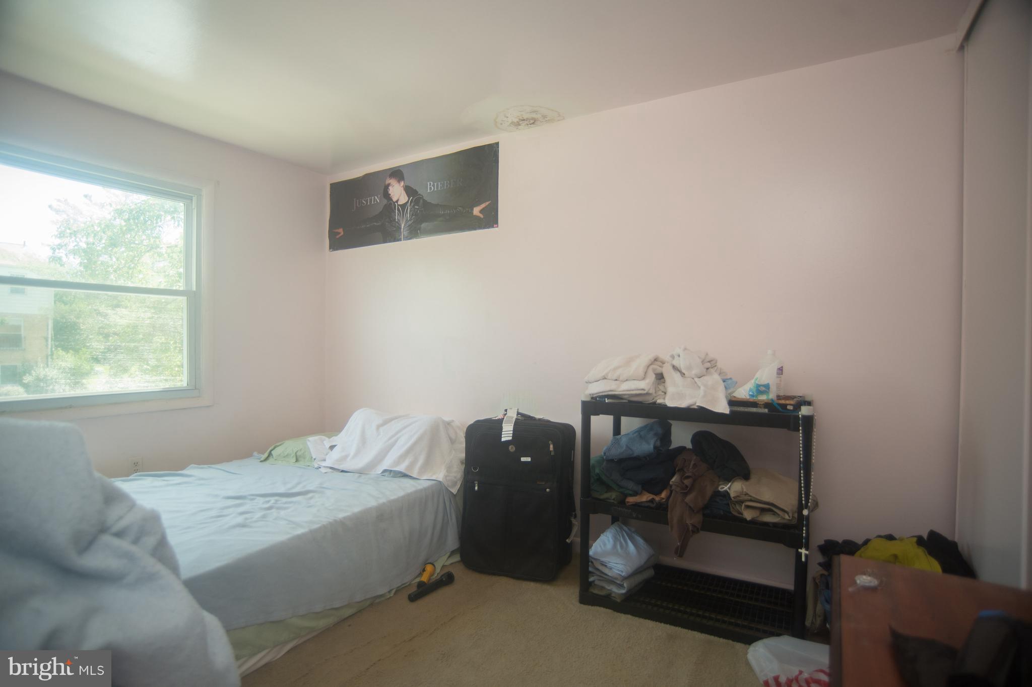 52 Timber Rock Road Gaithersburg, MD 20878 - Photo 16 of 30 a bedroom with a bed and a window