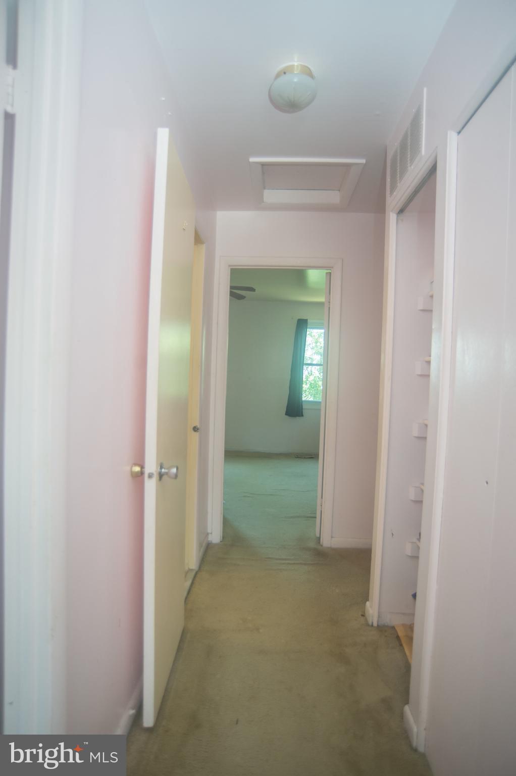 52 Timber Rock Road Gaithersburg, MD 20878 - Photo 18 of 30 a view of a bathroom from a hallway