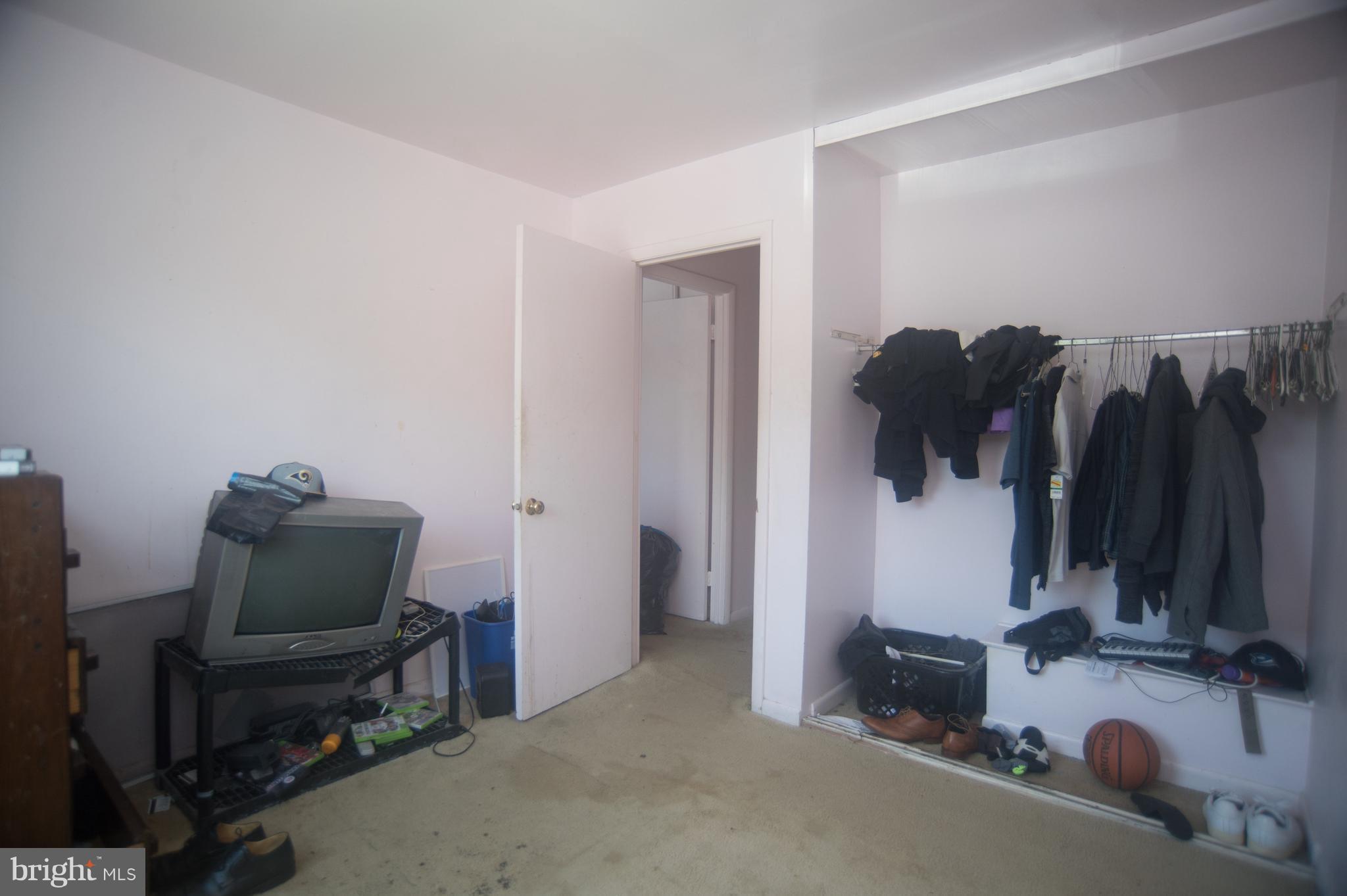 52 Timber Rock Road Gaithersburg, MD 20878 - Photo 21 of 30 a room with furniture and a flat screen tv