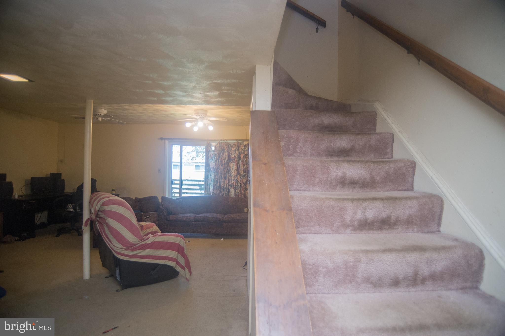 52 Timber Rock Road Gaithersburg, MD 20878 - Photo 24 of 30 a living room with furniture and a fireplace