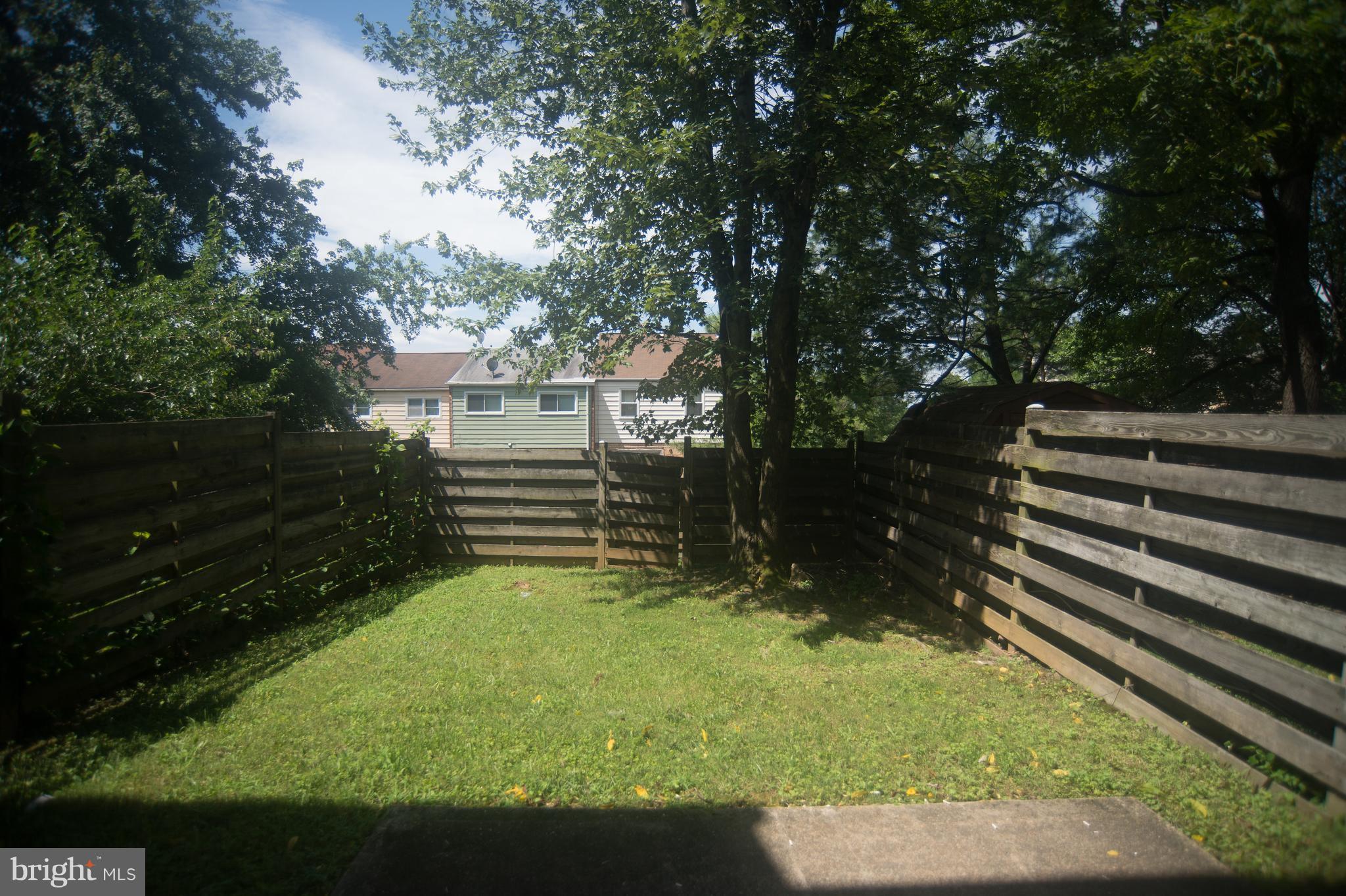 52 Timber Rock Road Gaithersburg, MD 20878 - Photo 26 of 30 a view of a backyard with a garden