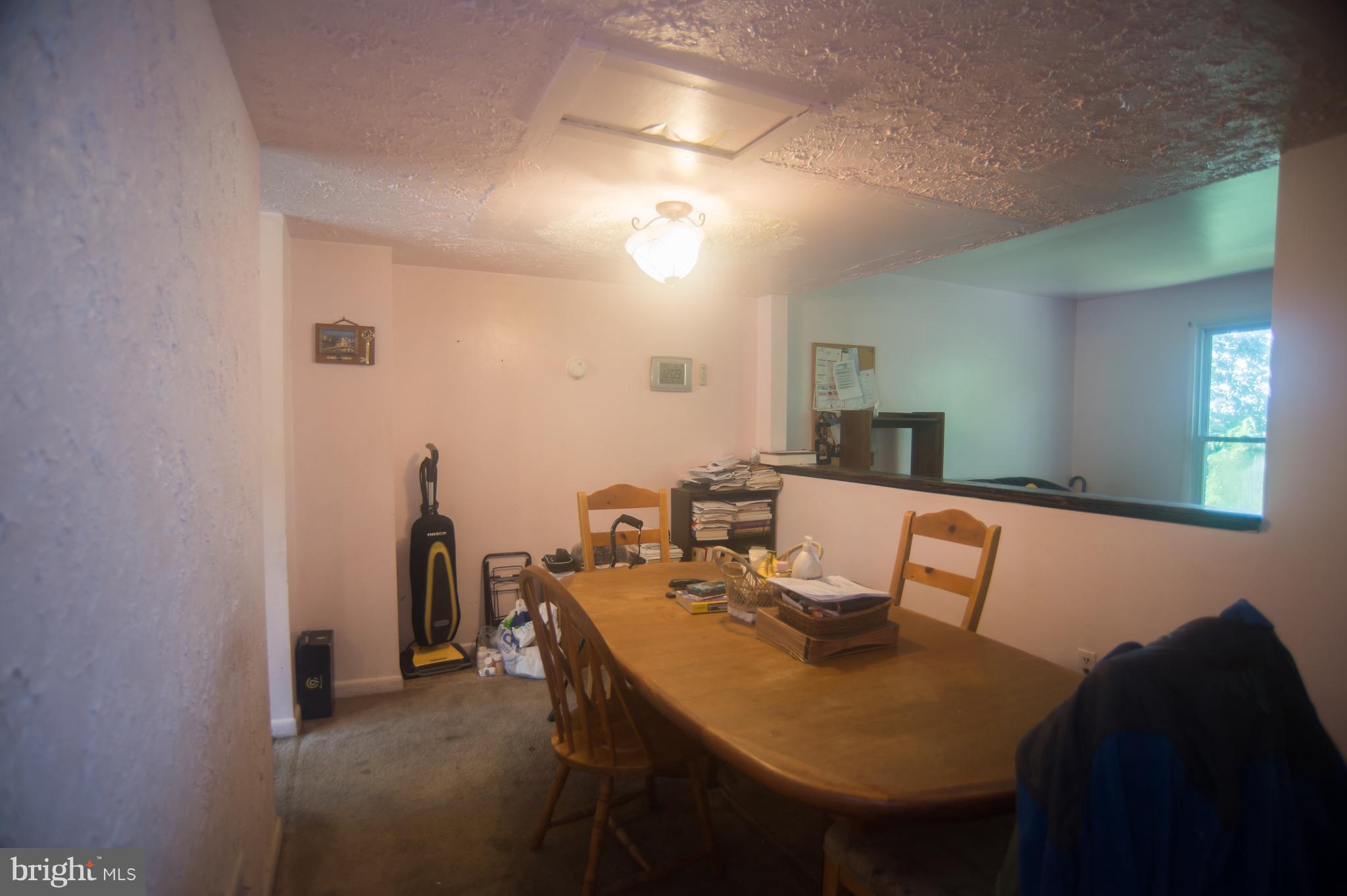 52 Timber Rock Road Gaithersburg, MD 20878 - Photo 6 of 30 a view of a dining room with furniture