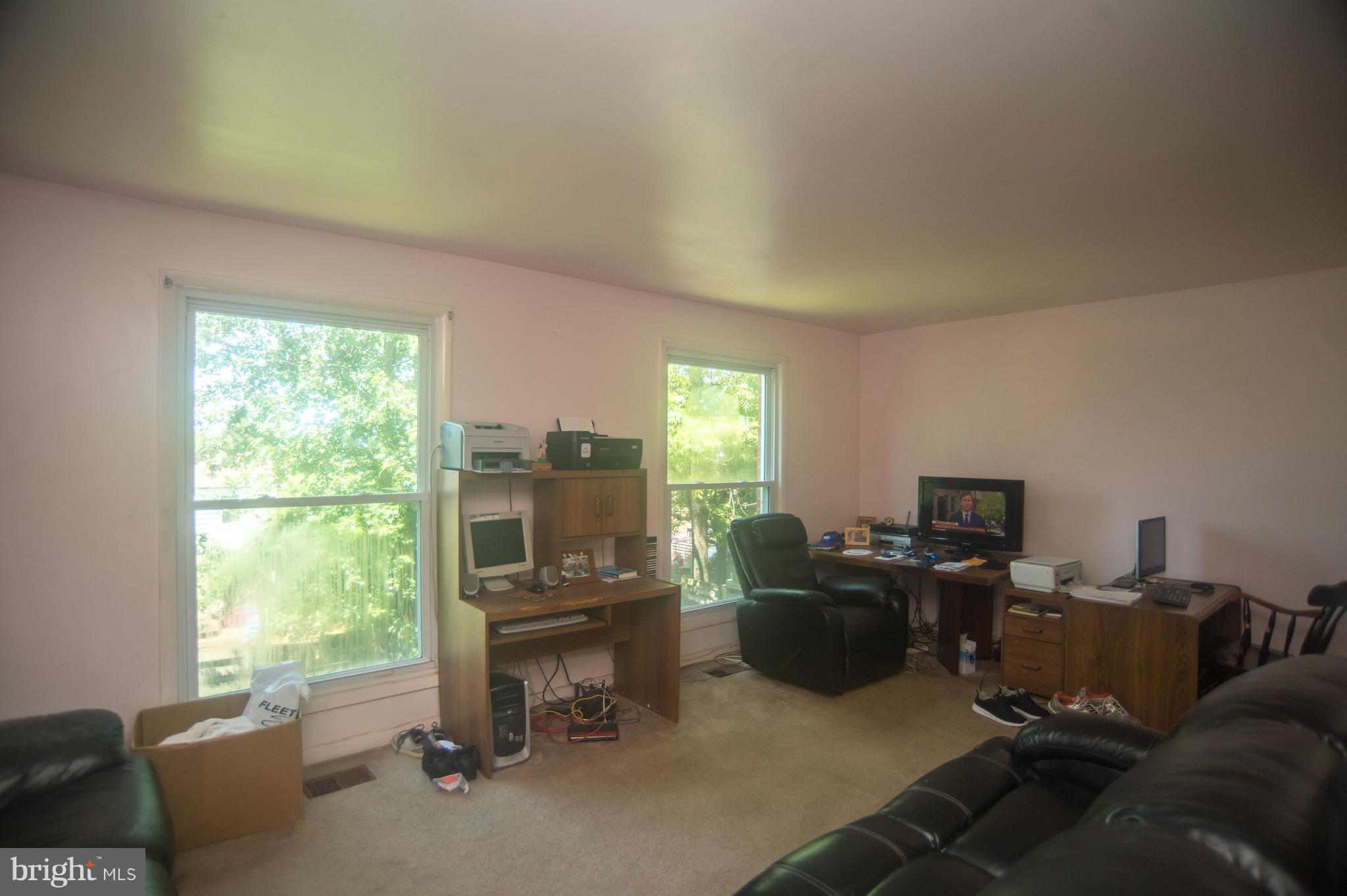 52 Timber Rock Road Gaithersburg, MD 20878 - Photo 9 of 30 a view of a livingroom with workspace and a window