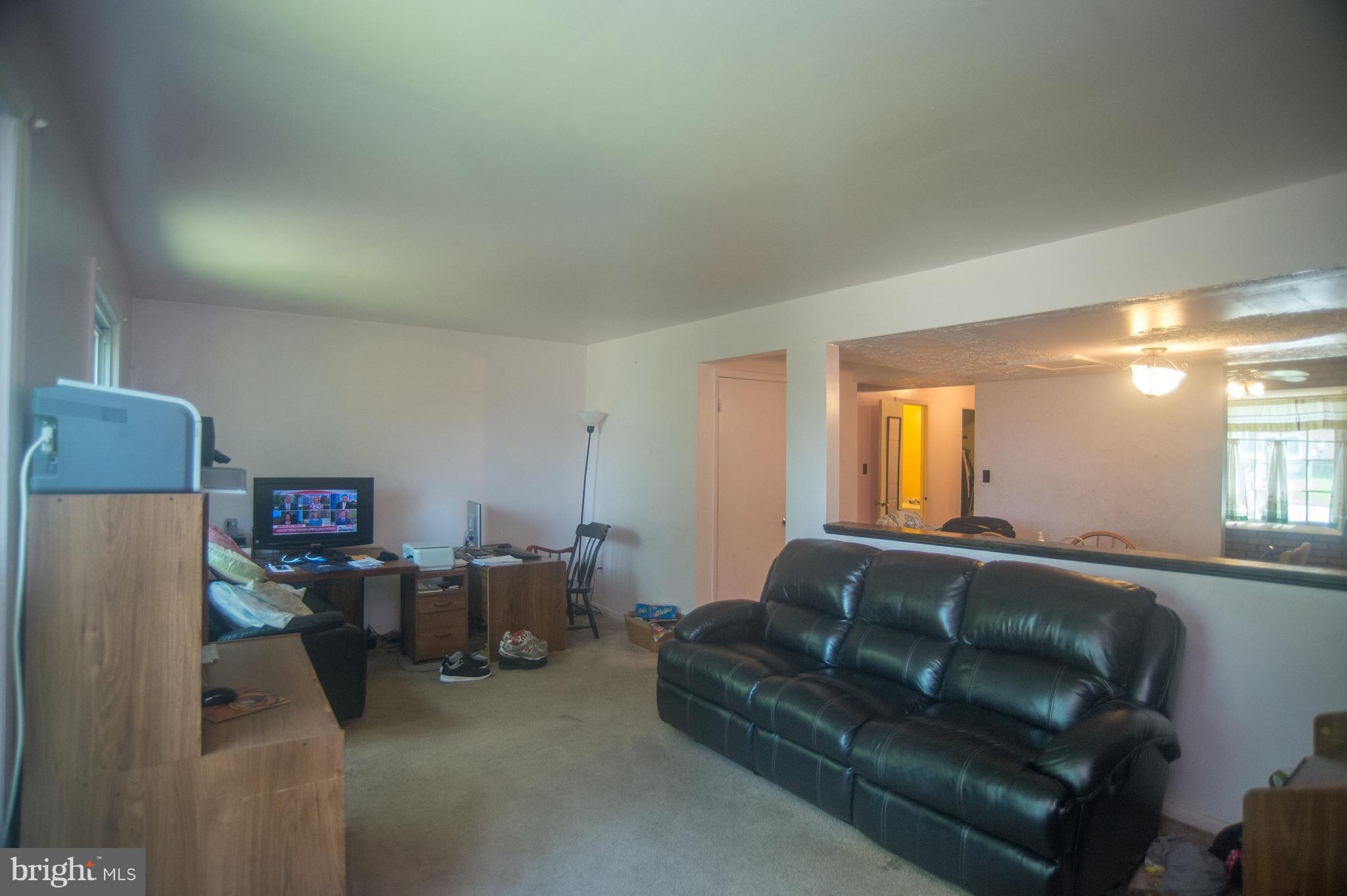 52 Timber Rock Road Gaithersburg, MD 20878 - Photo 10 of 30 a living room with furniture and a window