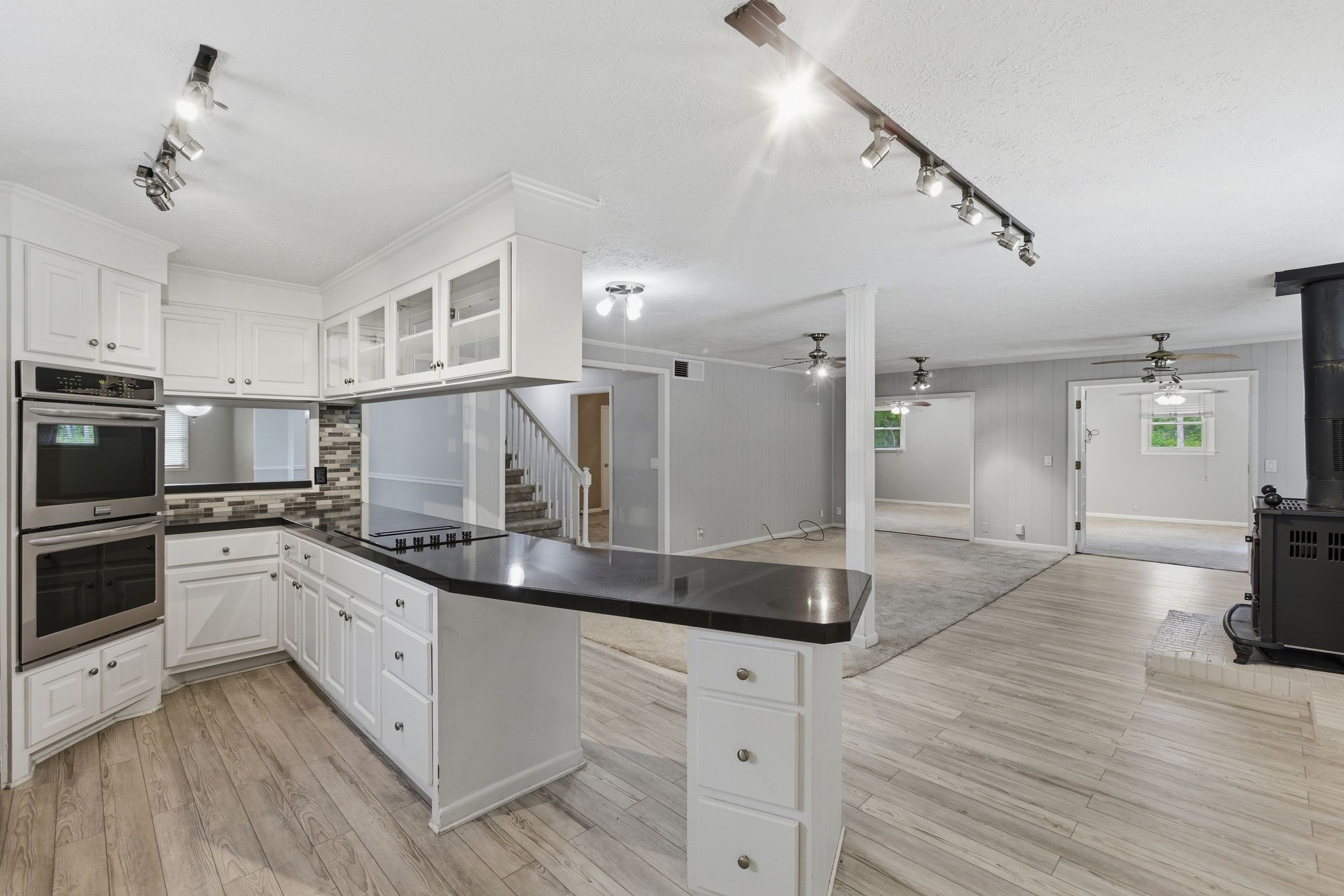 580 Defeated Creek Road Centerville, TN 37033 - Photo 18 of 71 a kitchen with stainless steel appliances granite countertop a sink a stove and a refrigerator