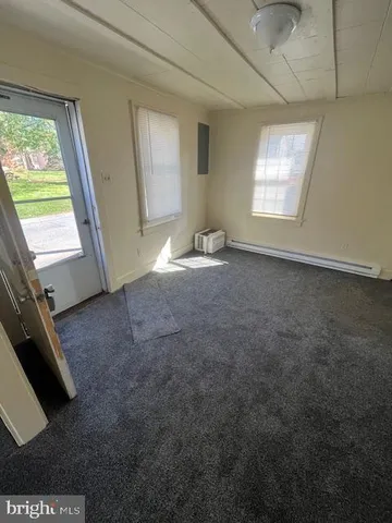 a view of livingroom with hardwood floor and window