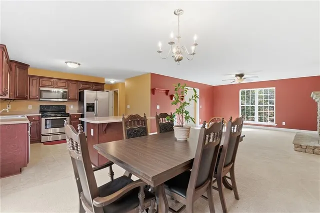 a view of a livingroom with furniture and a ceiling fan