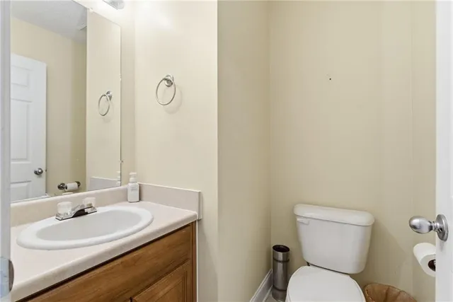 a view of a kitchen with furniture and wooden floor
