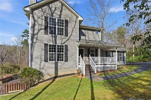a view of a two chairs and table in the balcony