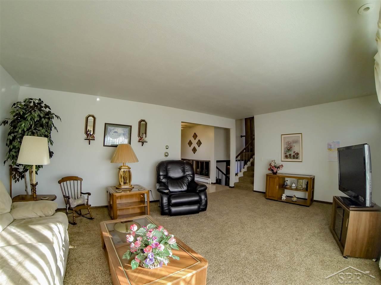 2366 West Wheeler Road Auburn, MI 48611 - Photo 4 of 15 All living spaces connect at the point in the far corner.