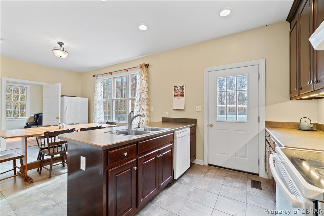 690 Glebe Landing Road Center Cross, VA 22437 - Photo 14 of 45 Exit out of the kitchen to expansive back deck