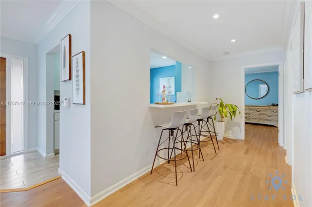 a view of a dining room with furniture and wooden floor