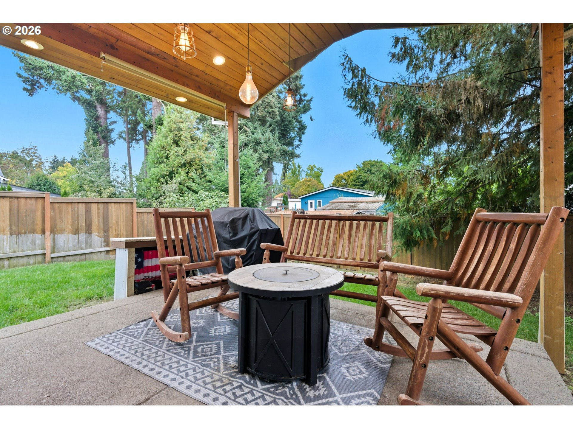 476 Southwest 15th Avenue Canby, OR 97013 - Photo 36 of 41 a backyard of a house with table and chairs
