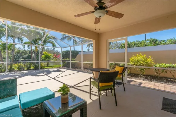 a view of a patio with a table chairs and a table