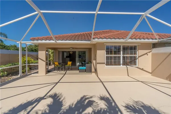 a view of a lake with houses in the back