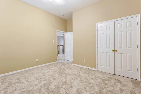 an empty room with closet area