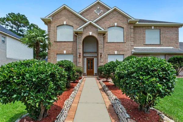front view of a house with a yard