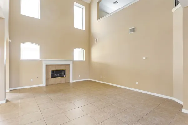a view of an empty room with a fireplace
