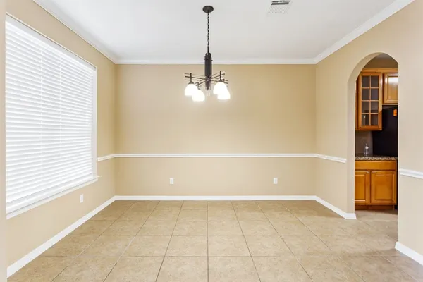 a view of a room with cabinet and windows