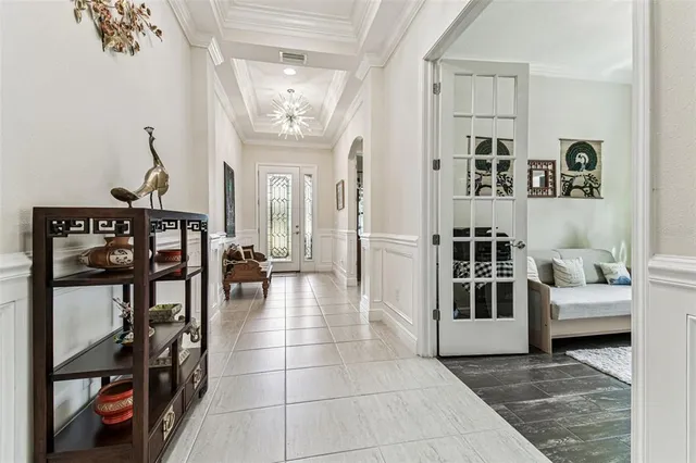a large kitchen with a counter space a sink appliances and cabinets
