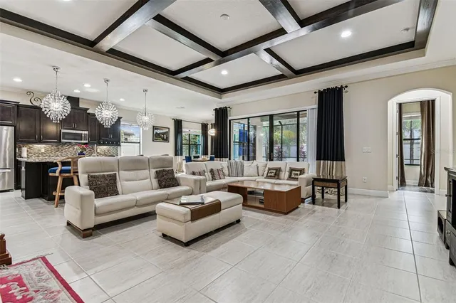 a kitchen with a granite countertop sink and natural light