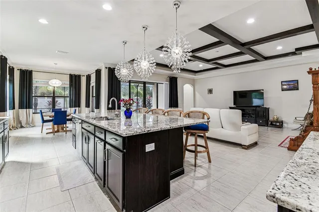 a view of a dining room with furniture large windows and wooden floor