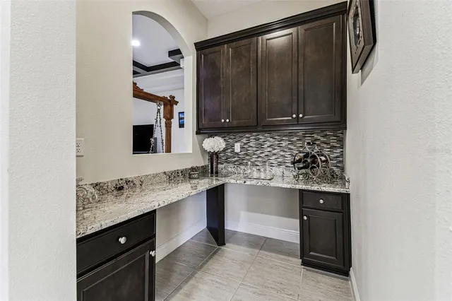 a living room with furniture a rug and a flat screen tv