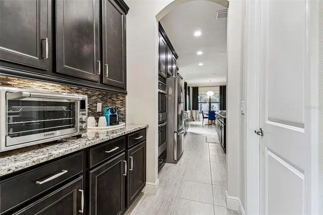 a bedroom with a bed and a flat tv screen in it