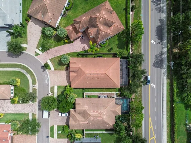 an aerial view of a house with a garden and a yard