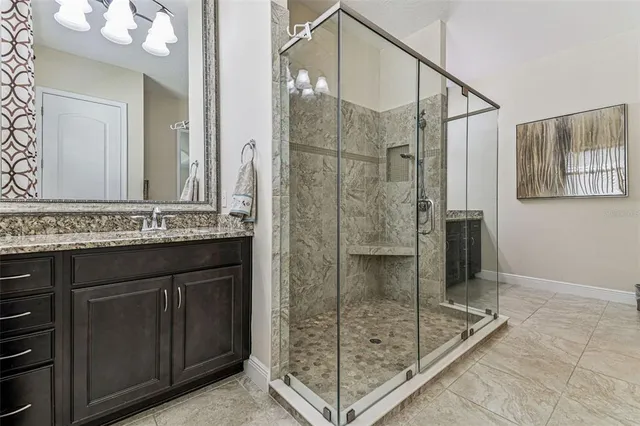 a bedroom with a bed and a book shelf