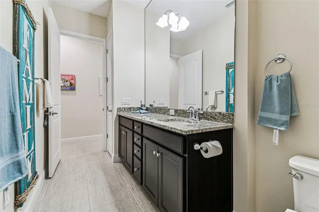 a picture of a bench in front of a building