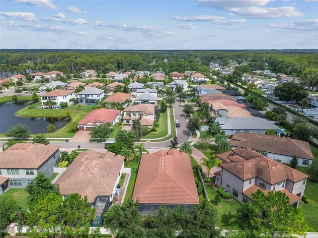 an aerial view of residential houses with outdoor space
