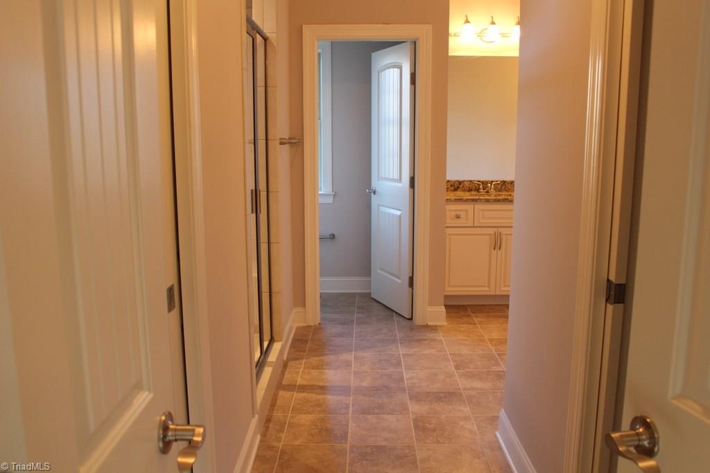 2237 Renaissance Lane High Point, NC 27262 - Photo 17 of 23 Master Bath featuring two separate closets and vanities. Large Tiled Shower and separate potty room for privacy.