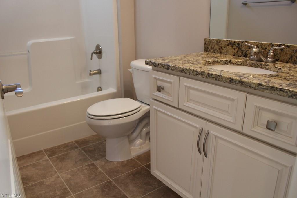 2237 Renaissance Lane High Point, NC 27262 - Photo 19 of 23 Full Bath in Hallway with Tile Floors and Granite Counters