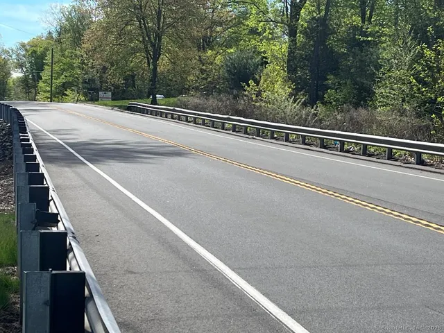 a view of a balcony with yard