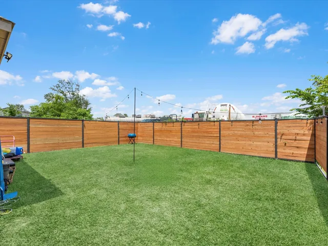 a view of a yard with a fence