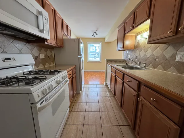 a kitchen with a stove and a sink