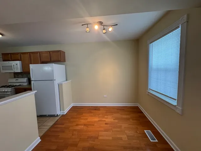 a view of a storage & utility room with a window