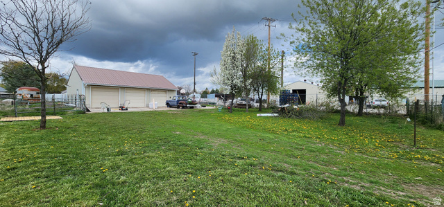 320 South State Street Preston, ID 83263 - Photo 17 of 20 View of yard featuring a detached garage and an outbuilding