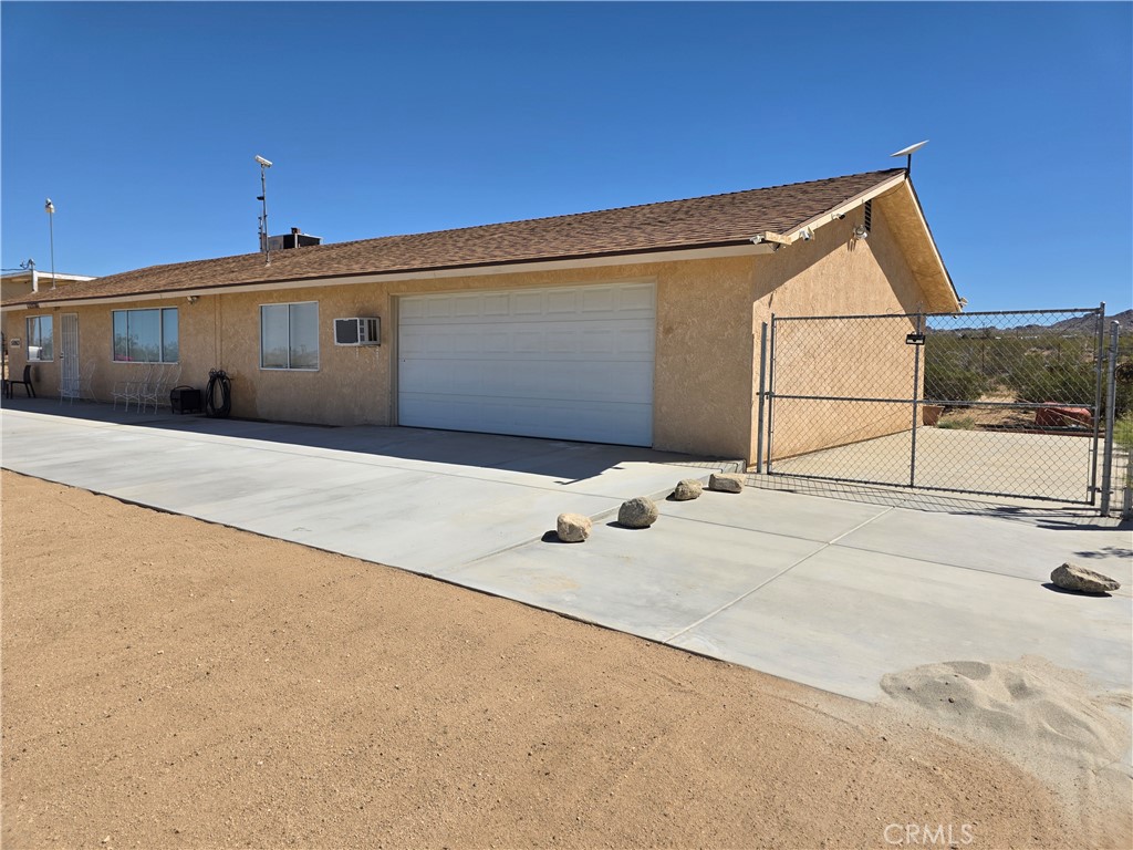 51063 Joshua Tree Road Landers, CA 92285 - Photo 2 of 38 Giant Garage, over 1000 square feet, enough for several cars, bikes, toys