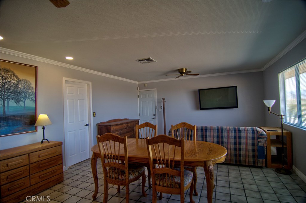 51063 Joshua Tree Road Landers, CA 92285 - Photo 24 of 38 There is a large living room with a dining area