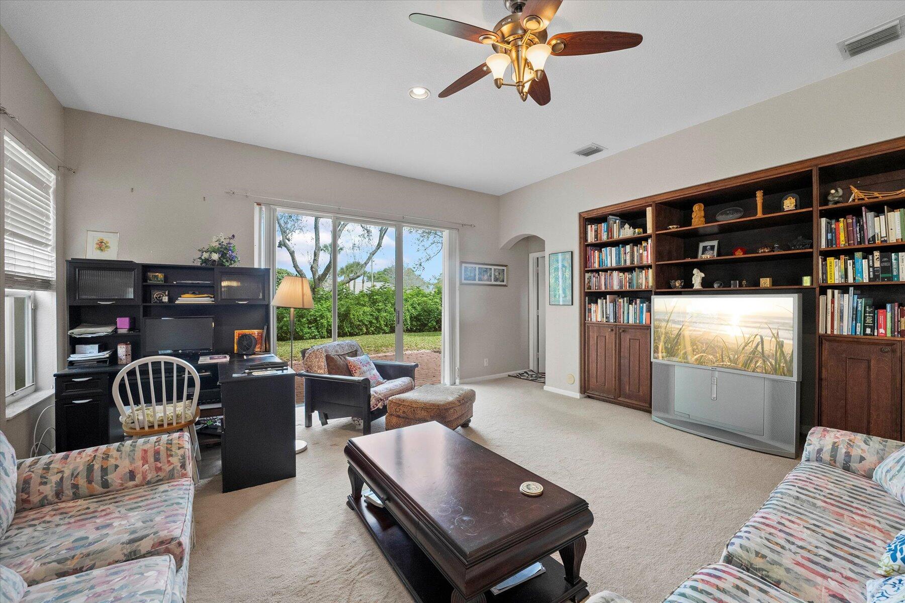 5002 Victoria Circle West Palm Beach, FL 33409 - Photo 16 of 37 a living room with furniture and a large window