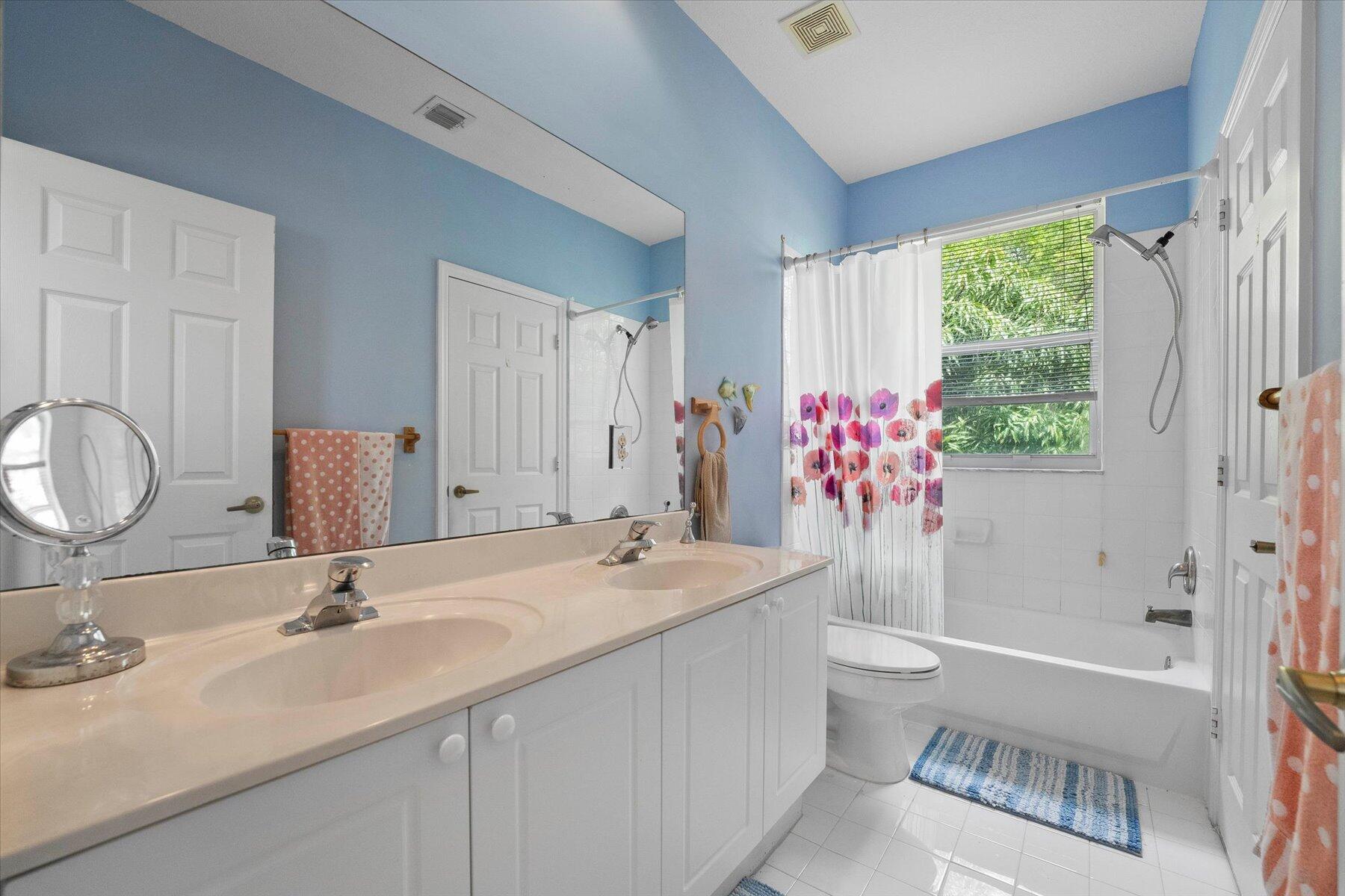 5002 Victoria Circle West Palm Beach, FL 33409 - Photo 27 of 37 a bathroom with a sink and a mirror