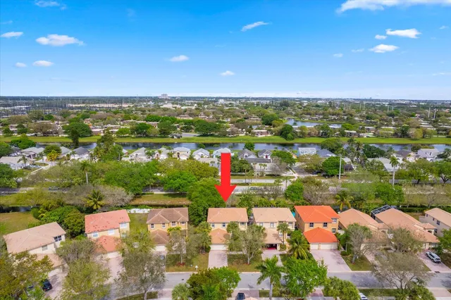 an aerial view of residential houses with outdoor space