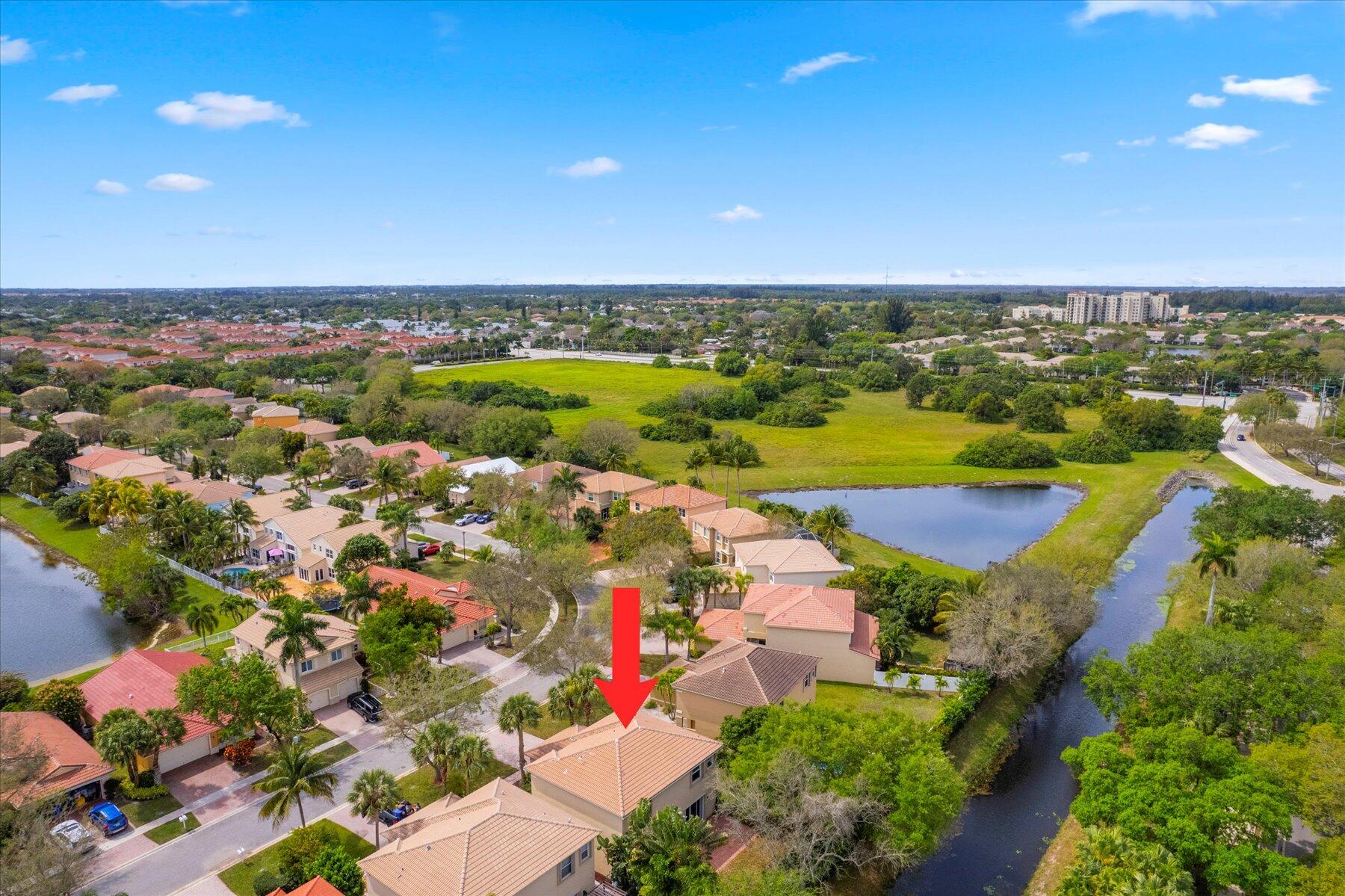 5002 Victoria Circle West Palm Beach, FL 33409 - Photo 33 of 37 an aerial view of residential houses with outdoor space and trees