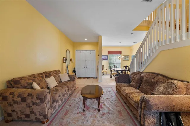 a living room with furniture and a rug